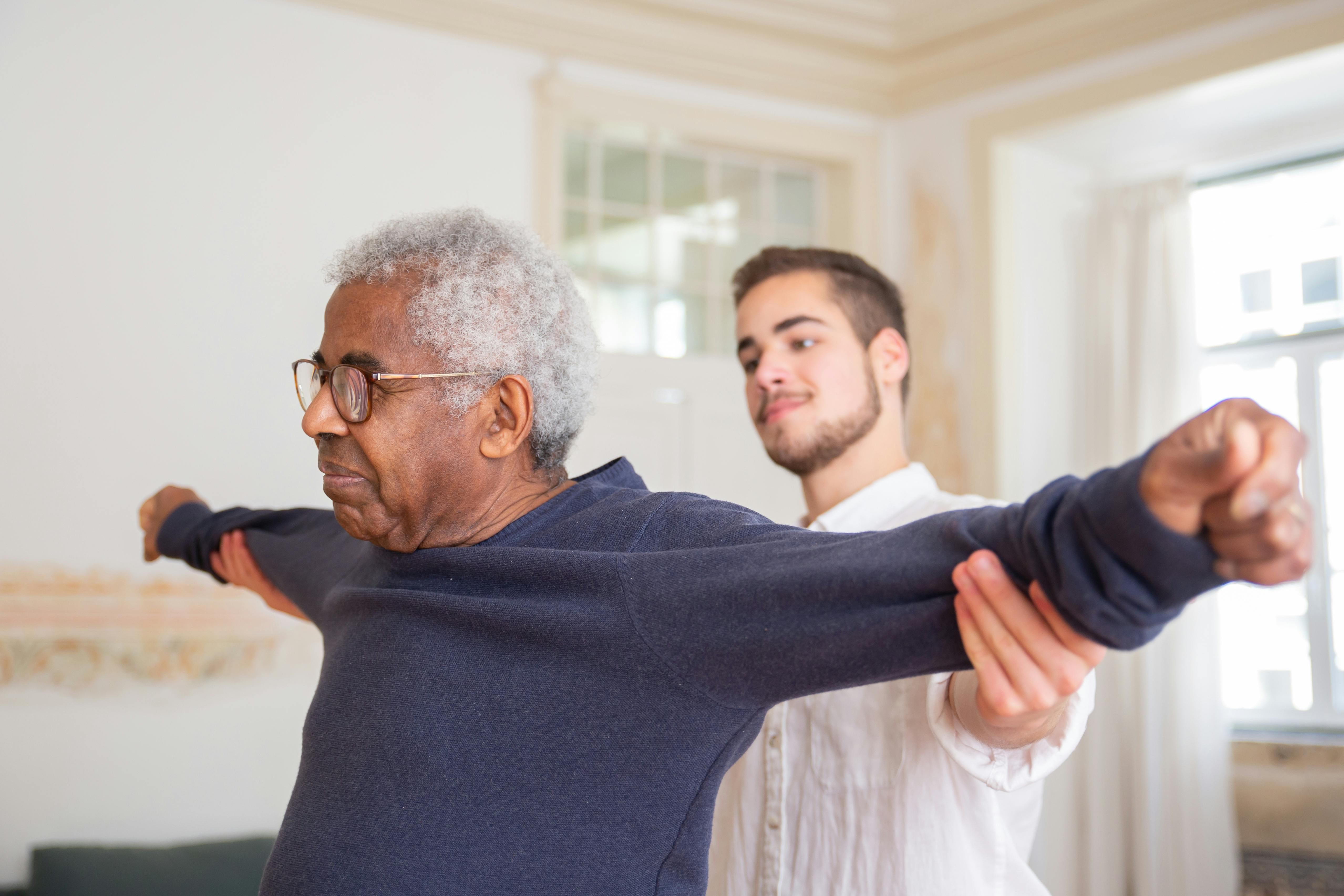 Resident in physical therapy session at Alpha Home a Waters Community